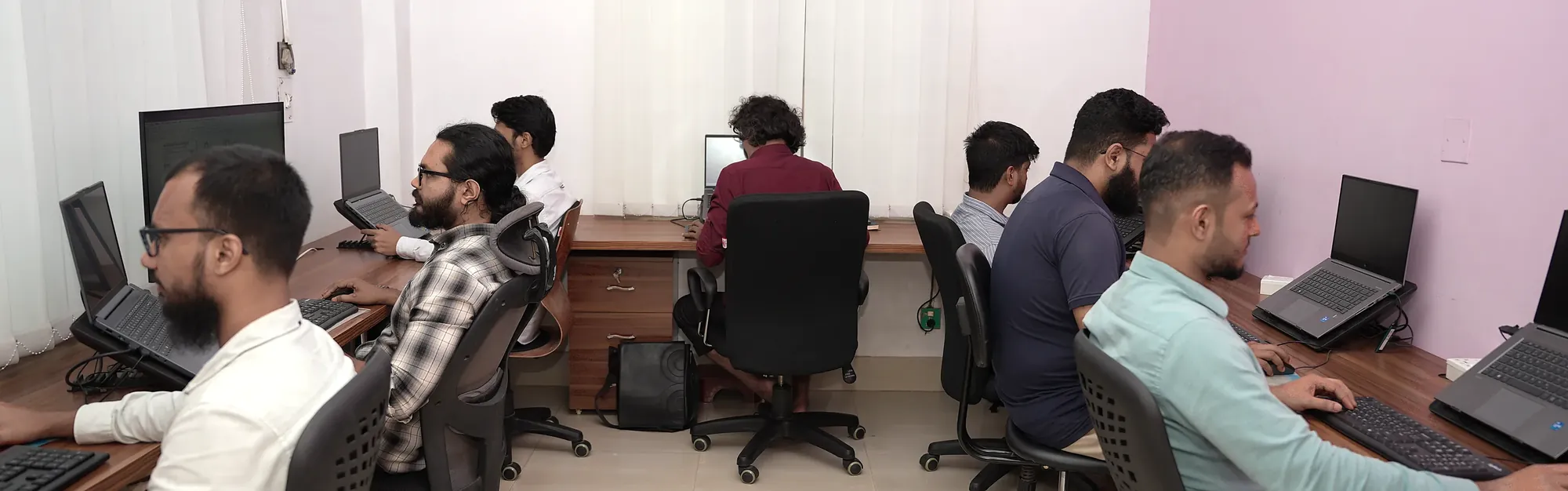 A team working at their desks in a bright open-plan office